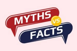 Two speech bubbles, one red with “MYTHS” and one blue with “FACTS,” are separated by a yellow circle with “VS” on a light pink background.
